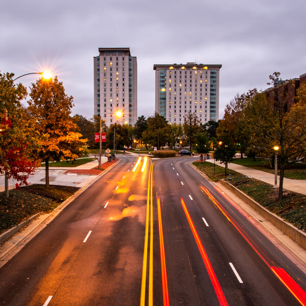 A street through campus photographed at night.